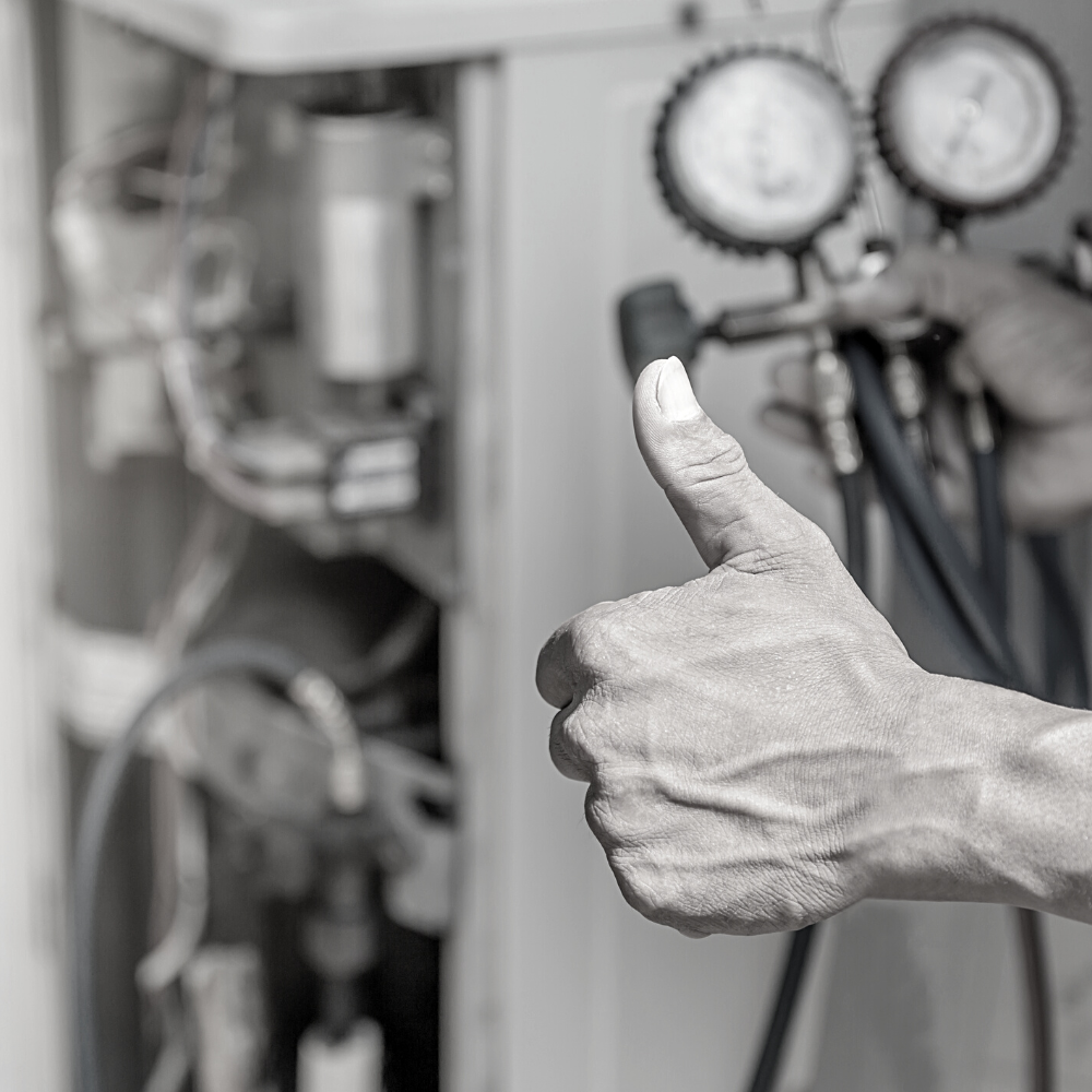 Property Management HVAC Services 1 An individual giving a thumbs up in front of a vending machine.
